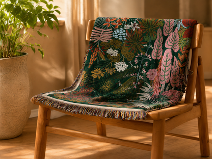 Tropical leaf woven blanket styled on a wooden chair