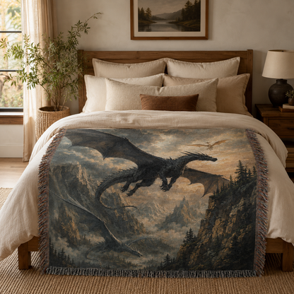 Dragon Flight fantasy woven blanket styled across the foot of a rustic modern bed