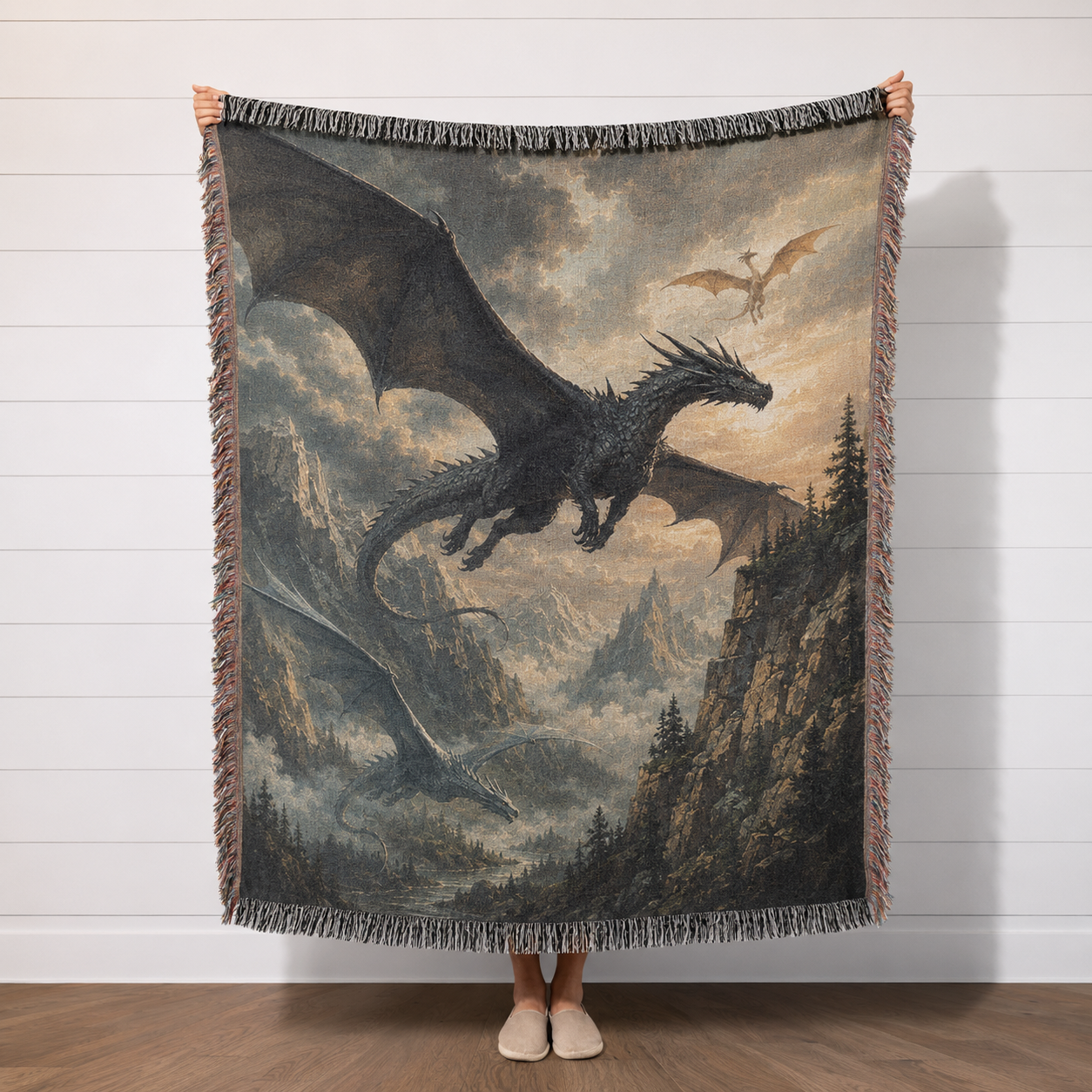 Dragon Flight fantasy woven blanket with dramatic mountain dragon artwork held in studio