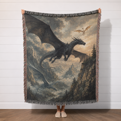 Dragon Flight fantasy woven blanket with dramatic mountain dragon artwork held in studio