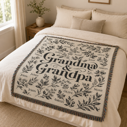 Custom Grandma and Grandpa woven throw blanket styled on a neutral bed