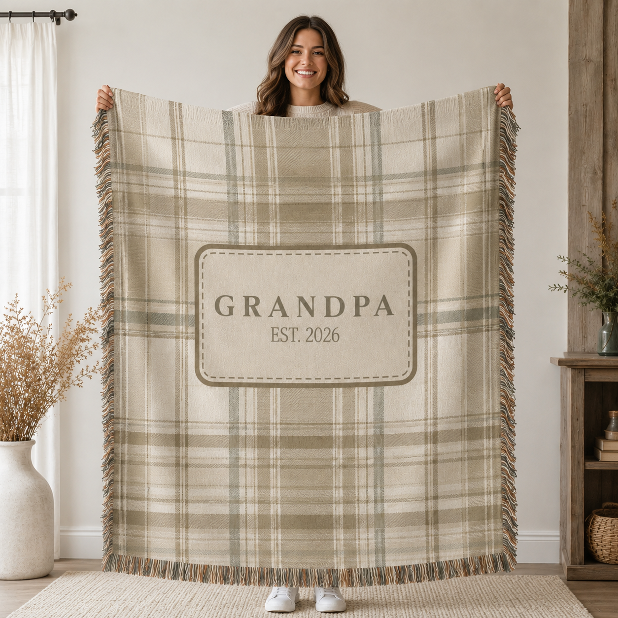 Woman holding personalized Grandpa plaid woven blanket to show its size