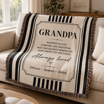 Custom Grandpa woven blanket draped over a neutral sofa