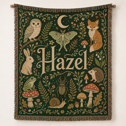 Personalized woodland name woven blanket with forest animals and mushrooms displayed as a tapestry