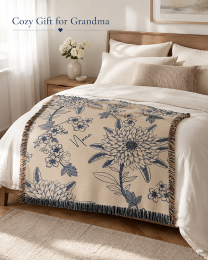Blue floral woven blanket on bed