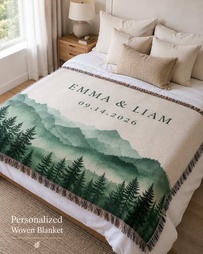 Personalized couple woven blanket displayed on a cozy bedroom bed