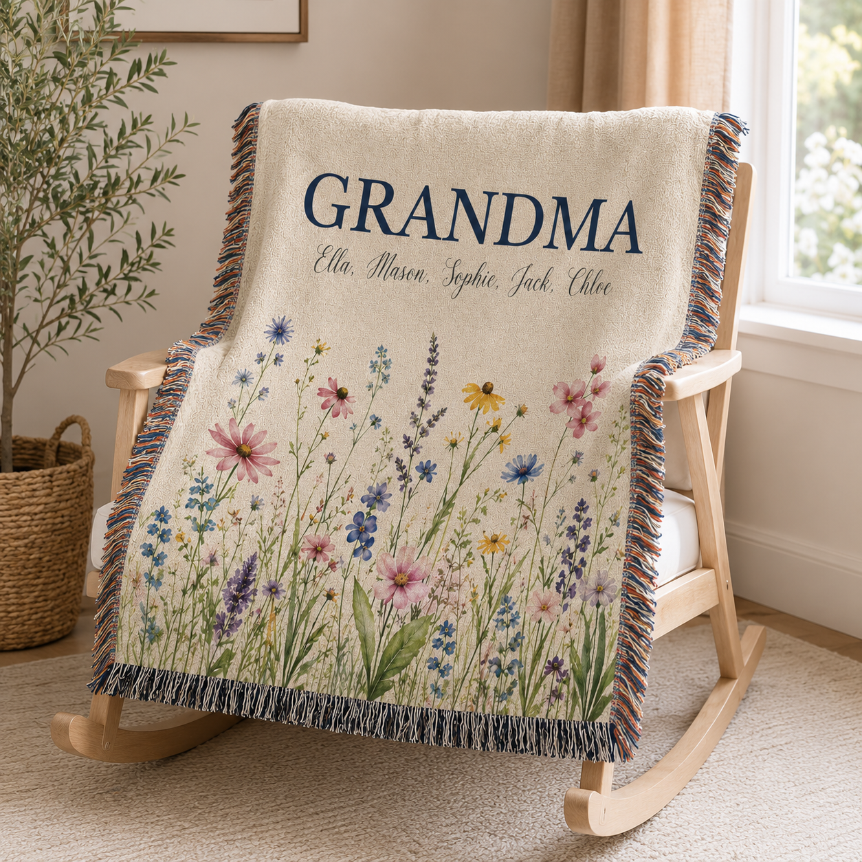 Personalized Grandma meadow wildflower woven blanket draped over a wooden rocking chair