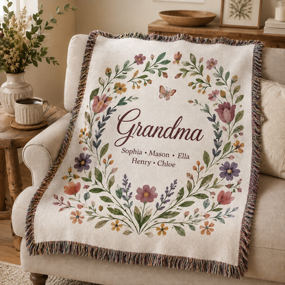 Personalized Grandma woven blanket with grandkids names and wildflower wreath design on sofa