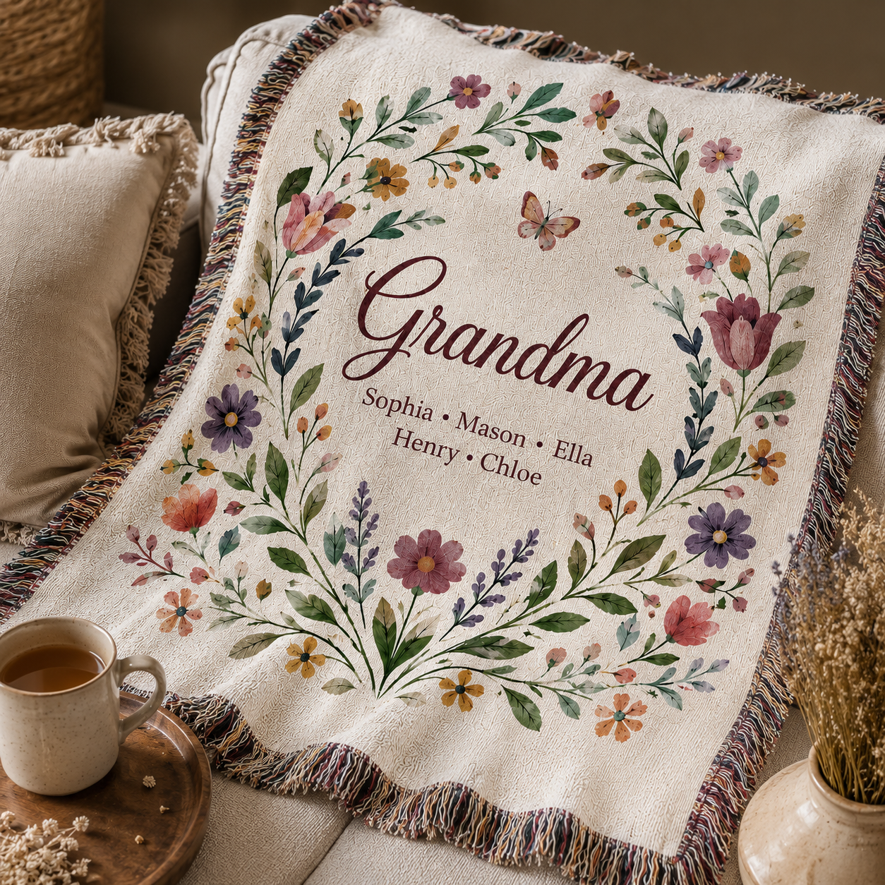 Close up of personalized Grandma woven blanket with floral wreath and grandkids names