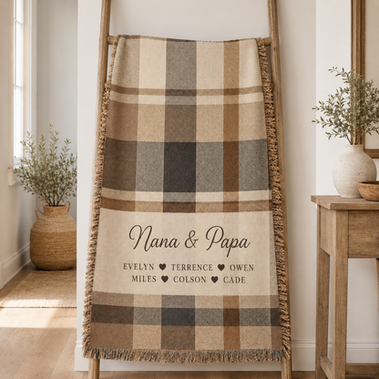 Custom grandkids names Nana and Papa woven blanket displayed on a wooden blanket ladder