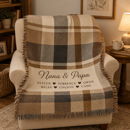 Personalized Nana and Papa plaid woven blanket draped over a cozy reading chair
