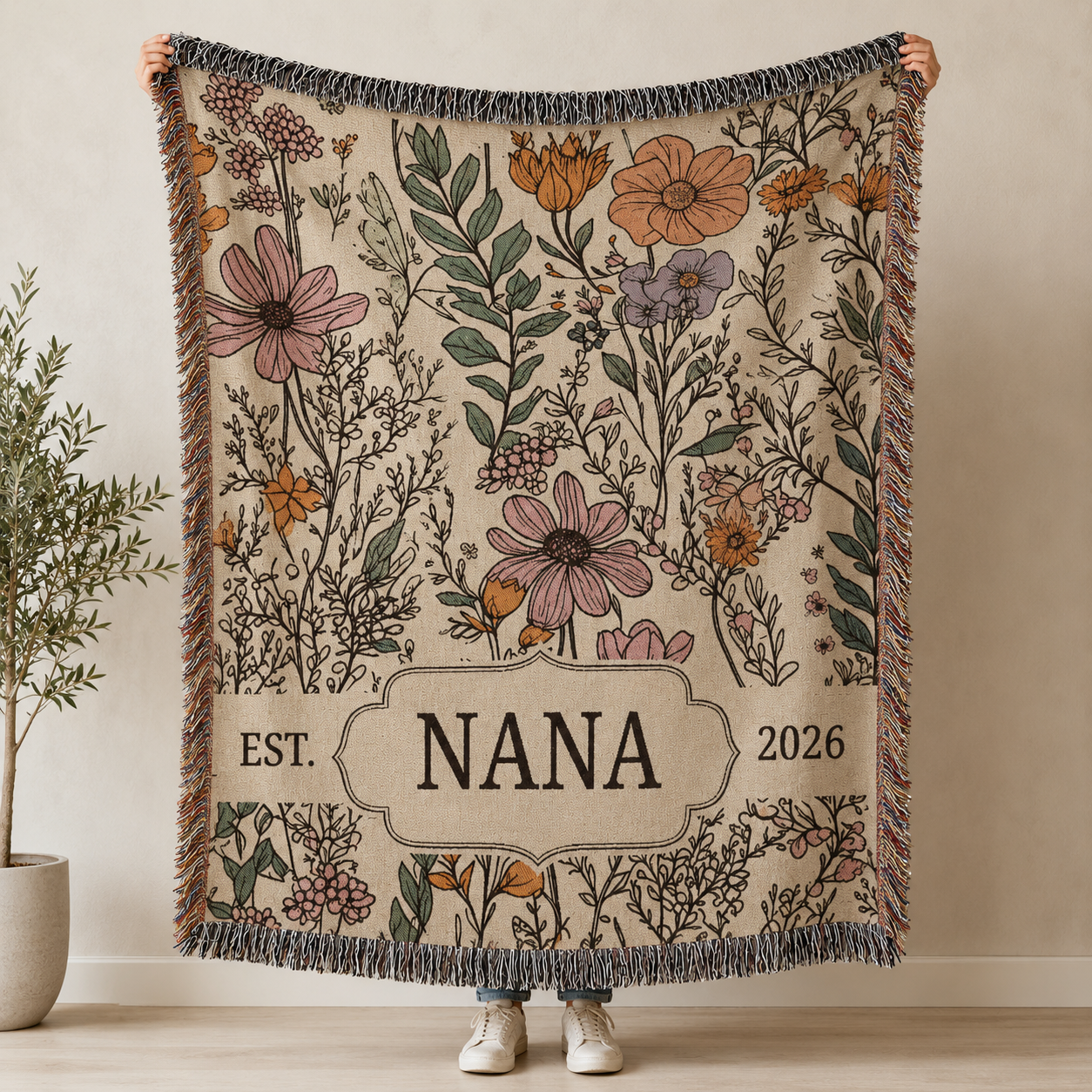 Personalized Nana wildflower woven blanket held up to show full custom floral design
