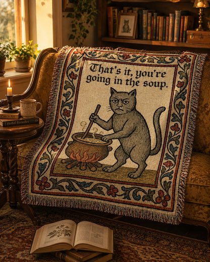 Funny medieval cat woven blanket styled in a reading nook