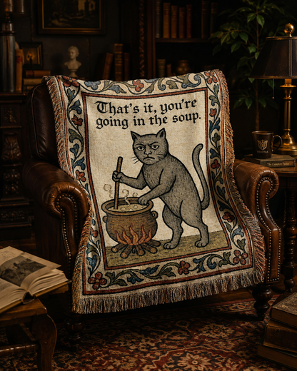 Funny medieval cat woven blanket in a dark academia room