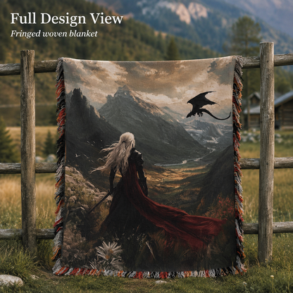Full design view of fringed woven blanket on a rustic fence